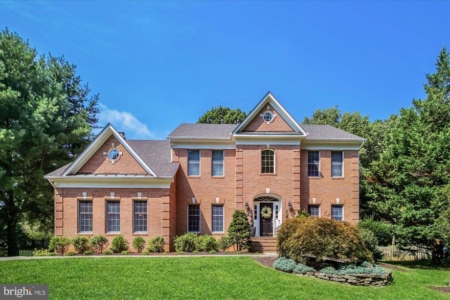Located on a beautiful half acre lot in the north side of Vienna, this majestic and charming red-brick colonial is renovated and move-in ready. Featuring an optimal open floor plan with 4 large upper level bedrooms and a nanny/au pair suite in the lower level. Main level features a stunning two-story foyer, main level office, large formal living and dining rooms, exquisite gourmet kitchen with large kitchen island, gorgeous breakfast area into a large and cozy family room w/fireplace, and a coveted mudroom w/cubby leading into the two-car garage. Truly turn-key with no details spared in this immaculately kept residence. Adorned with beautifully refinished hardwood floors, crown molding, chair molding, wainscoting details, designer lighting fixtures, fresh paints, and vaulted ceilings! Fully fenced in yard offers a playground, patio and large deck for all your summertime BBQs.  Beautiful and large flat backyard is private has plenty of green space with beautiful tree lines at the back of the yard. Everything has been handled including a brand new roof! And no HOA! A short distance through trails to the metro station, adjacent neighborhoods, and the restaurants/shops in Tysons! Enjoy all the amazing amenities of the Town of Vienna including top restaurants, shopping, groceries, parks and more. Quick access to downtown Tysons, Dulles & Reagan airports, metro stations, major roads & highways, Wolftrap Center for the Performing Arts, Meadowlark Gardens, Washington DC, and so much more! Top & highly ranked elementary, middle and high schools!! DON'T MISS YOUR CHANCE ON THIS HOT PROPERTY - This remarkable home will have all your boxes checked! A MUST SEE!