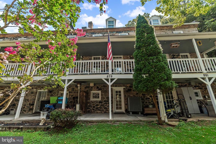 RARELY AVAILABLE!!!  LARGE Historic Oella Town Home, c. 1812!!  Does your heart just WARM when you wind through the lush hilly streets of Oella?  Have other local floor plans been awkward and too small for your needs?  Now own a SIZABLE town home (approx. twice the size of some other TH in the immediate vicinity) with a practical layout in the heart of hard-to-come-by  historic Oella. Originally built to provide a home for local mill employees more than 200 years ago, this precious home radiates historic character, yet offers all modern amenities. UPDATED kitchen with GRANITE countertops and SS appliances and EXPOSED STONE WALL, with a pass-through window to the dining room! Cork tiles in kitchen and HARDWOOD FLOORS throughout the main level! Elegant Beaux-Arts lighting fixture in Dining area STAYS, as does microwave!  COZY UP in your Living room, with floor-to-ceiling ornamental BRICK FIREPLACE with STONE hearth! Fireplace is sealed, but *can be* unsealed for use. Adjacent to the living room is your wide deck, FRESHLY PAINTED, overlooking the very green hill below - watch nature with a cup of coffee or glass of wine!  Next, there are 2 Upper levels, each with its own VERY LARGE BEDROOM!! First Upper level has FULL BATH and DRESSING AREA/BONUS ROOM!  Upper Level 2 bedroom has HUGE WALK-IN closet that spans most of the width of the home!  Walkout Lower Level to patio and green yard!  Lower Level bedroom and FULL BATH!  Summer 2023 updates: NEW SIDING, FRESH EXTERIOR PAINTING and WINDOW & DOOR SEALING by Wockenfuss, and PROFESSIONALLY CLEANED CARPETS - JUST FOR YOU!  HOA grants 2 Parking unassigned spaces in the on-site lot!  HOA provides snow removal in parking lot and common-area grass cutting. Other PERKS: No Front Foot fees!  No Flood Plain!!  2 additional FIREPLACES are walled into the Lower Level and the 1st Upper Level bedrooms (above and below the Living Room fireplace)!!!    *Any offers received will be reviewed on Monday August 28th, although seller reserves the right to accept an offer at any time. SHOWINGS BEGIN TUESDAY, 8/22.