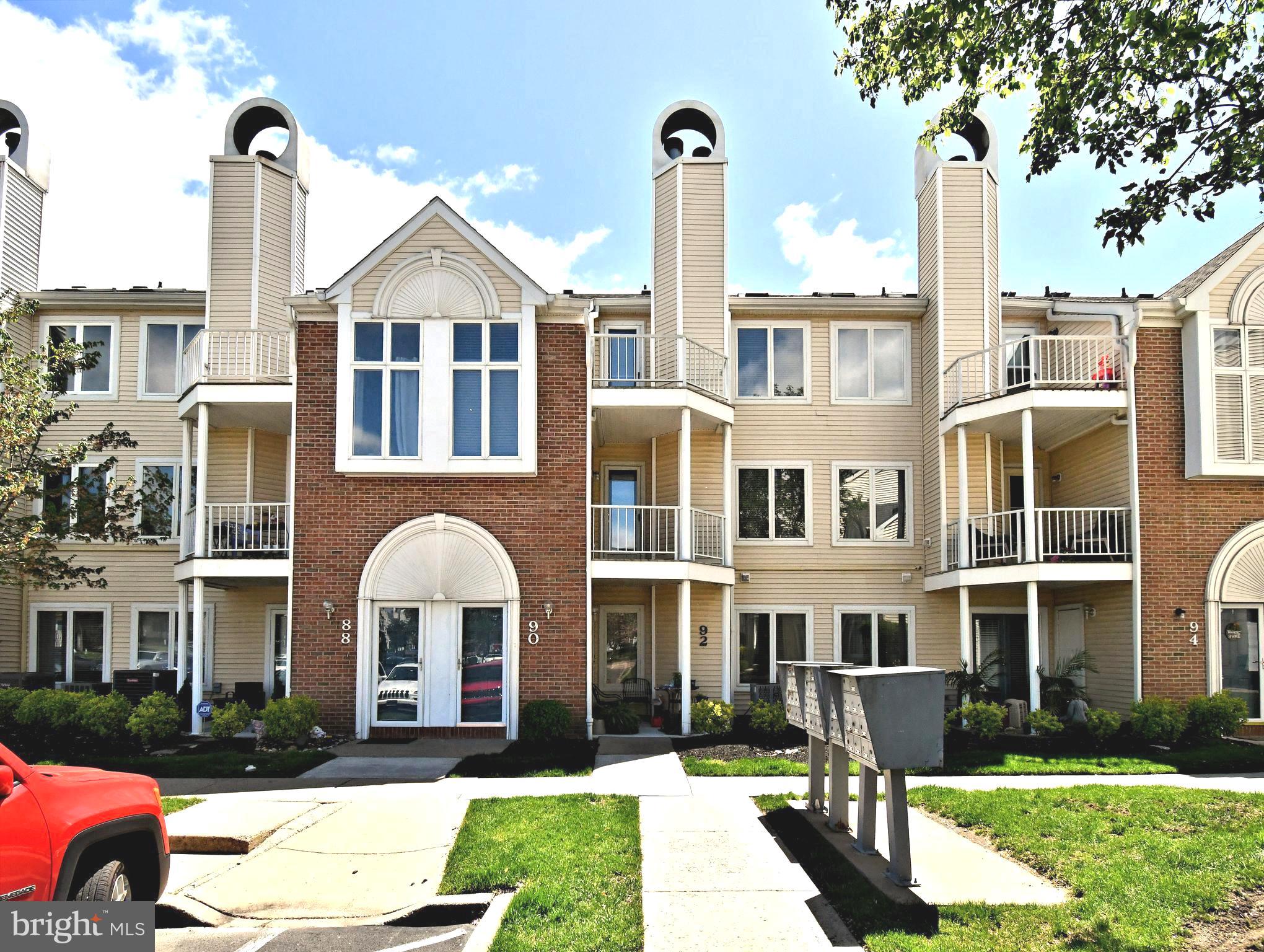 90 Catherine Court is a two-story condominium located in the Crestwood Condominiums of Levittown, PA. Built in 1990, this 2-bedroom, 1.5-bath unit offers a spacious and functional layout. The open-concept design seamlessly connects the living room, dining room, and kitchen, creating a welcoming space for entertaining. The living room features a fireplace, new LVP flooring and access to a private balcony. Off the main living area is an updated powder room. Upstairs, with new carpet throughout, the main bedroom is illuminated by skylights and includes a walk-in closet and a loft area, offering additional space. The second bedroom also has access to a balcony, providing outdoor space. The hall bathroom is equipped with double sink and a vanity, adding convenience to your morning routine. Finalizing upstairs is a laundry room. Residents have access to a range of amenities, including a fitness center, swimming pool, basketball courts, and a clubhouse. This location offers easy access to major highways such as I-95, the Pennsylvania Turnpike, and bridges to New Jersey making commuting a breeze. Nearby, you'll find a variety of shopping centers, dining establishments, and entertainment options, ensuring that all your needs are met within close proximity.