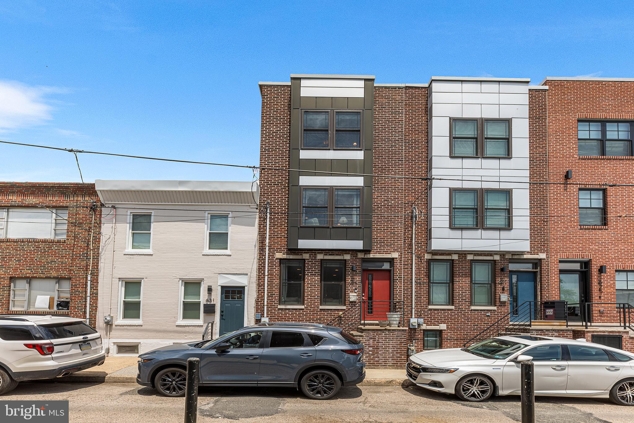 Welcome to this newer built rowhome tucked away on an exceptionally quiet block in the heart of East Passyunk Crossing. Perfectly positioned just blocks from BOK, Passyunk Avenue, the Italian Market, and all the coffee shops and parks along Moyamensing Ave — plus directly across the street from a community recreation center with a pool — this home offers both convenience and comfort in one of South Philly’s most sought-after neighborhoods. Enter inside to discover an open concept main level featuring gleaming hardwood floors, large sun-filled windows, and seamless flow between living, dining, and kitchen spaces. The stylish eat-in kitchen is a true showstopper featuring an island with seating for casual dining, granite countertops, stainless steel appliances, gas cooking, and modern finishes throughout. A door off the kitchen opens to a spacious private rear patio with brand new fencing — perfect for relaxing or entertaining outdoors. The second level offers two generously sized bedrooms, a full hall bath with a tub/shower combo, and a convenient laundry room. The top floor is dedicated to a spacious primary suite boasting a tray ceiling, large closet, and a spa-like ensuite with dual vanity and walk-in shower with new shower head. Up one more level is access your private rooftop with sweeping views of the city skyline — ideal for morning coffee or sunset gatherings. The fully finished basement provides additional living space tailored to your needs — whether a media room, home office, gym, or guest space — complete with a full bathroom featuring a walk-in shower. Don’t miss your chance to own a modern, move-in ready home in a prime South Philadelphia location that truly has it all.