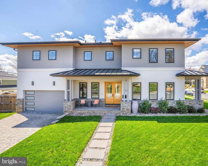 UNDER CONTRACT - STILL SHOWING AND ACCEPTING BACK UP OFFERS! Interested parties are invited to tour the home and meet directly with the original builder, to learn more about our other projects and our design-build process. Experience modern living in this custom-designed 2020 home by ArcHaven Homes, formally Pollard Homes. Situated on a quiet, tree-lined street, this 6-bedroom, 5.5-bath home offers over 6,300 SF of thoughtfully designed space with premium finishes. Step inside to 10-ft ceilings, wide-plank European oak floors, and a seamless open floor plan. The chef’s kitchen features a quartz island, professional appliances, and a walk-in pantry. The great room boasts a gas fireplace, built-ins, and glass doors leading to a two-level deck and fenced backyard. A butler’s pantry connects to the elegant dining room, perfect for entertaining. The primary suite is a private retreat with a spa bath, double shower, deep soaking tub, and custom dressing room. The north bedroom has a walk-in closet & en-suite bath, while the east & south bedrooms have spacious closets & private baths. The oversized laundry room features 65+ sq. ft. of space with quartz countertops, cabinets, and a sink. The lower level includes two additional bedrooms, a full bath, a wet bar, a media room, and 600+ SF of storage. Built with 2x6 framing and an insulated pre-cast foundation, this home offers superior energy efficiency and durability.