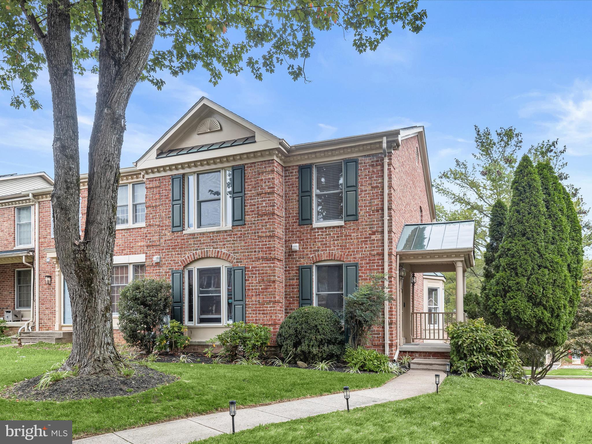 Welcome to the sought-after Greenspring East community of Pikesville, just moments from the shopping, dining, and conveniences of Quarry Lake. This brick end-unit townhouse blends comfort and style, beginning with hardwood floors that flow seamlessly through the open-concept dining and living areas. The dining room features crown molding and overhead lighting, complemented by a modern ceiling fan. In contrast, the living room offers custom blinds, a bay window, and a double-sided gas fireplace that shares space with the dining area, ideal for entertaining or cozy evenings. The kitchen is beautifully appointed with display cabinetry, updated flooring, a decorative backsplash, stainless steel appliances, Quartz counters, and a spacious pass-through to the dining room for ease of hosting. Step outside to the spacious deck for effortless indoor-outdoor living. The upper-level primary suite is a retreat, featuring hardwood floors, vaulted ceilings, a walk-in closet, and a spa-like bath with a soaking tub, dual vanity, and walk-in shower. Two additional bedrooms and a full hall bath complete the sleeping quarters. The fully finished lower level extends your living options with a guest suite, full bath, kitchenette, laundry, and direct access to the beautifully landscaped yard. Convenient to I-695, I-83, and I-95, this home offers easy access to both downtown Baltimore and Washington, D.C. Updates: Sliding Glass Door, Laundry Room, Lower Level Bath, Hot Water Heater, Stove, Microwave, Carpet on the Stairs, Ceiling Fan, Hearing Impaired Smoke Detectors, and the Faucet in the Kitchen.