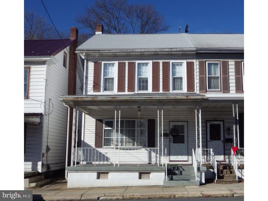 BEING SOLD "AS IS".  Large duplex at the end of town. Fixer-upper. Great Investor or DIY property. Home has first floor water damage from burst pipes, 2nd floor still in good condition. Full bath and Laundry on main floor. Range & Refrigerator remain. Dining room was last used as a bedroom, can remove the closets to put back to original dining room. Main floor AC but uncertain if still works due to water damage. Contents will be removed.