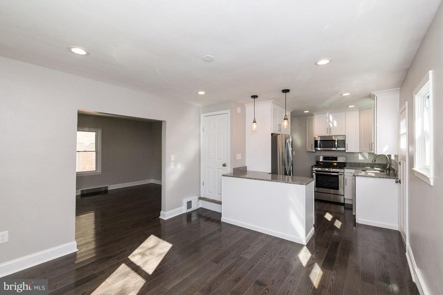 Back on the Market Financing Fell Through! Gorgeous Renovation in a Wonderful Neighborhood! New Hardwood Throughout the First Floor. Open Kitchen with White Cabinets, Granite Counters and Stainless Steel Appliances. Two Bedrooms and Full Bath on First Floor. Two Additional Bedrooms on Second Floor. Fully Finished Lower Level with Bonus Room that could be used an Additional Bedroom or Office. Full Bathroom in Lower Level.  A Beautiful Home in a Great Location!