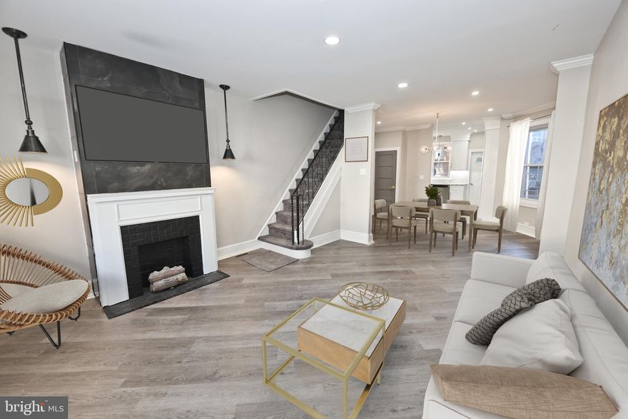 ONE YEAR HOME WARRANTY INCLUDED! Elegantly renovated property! The first floor of this home has been built with a highly desired open floor plan. The kitchen is ultra-luxury! Beautiful white cabinets with gold hardware! Stainless steel appliances. The kitchen also features stone counters, a gold pot filler usually found in European kitchens, and luxury stone floors! Beautiful dining area with luxury lighting and floor have been inlaid in an angle for a modern look! Lots of storage space in the basement for a workshop! Bedrooms are generously sized! Main bath is luxury with custom marble/stone floors and shower walls! This is a must see in an amazing location!