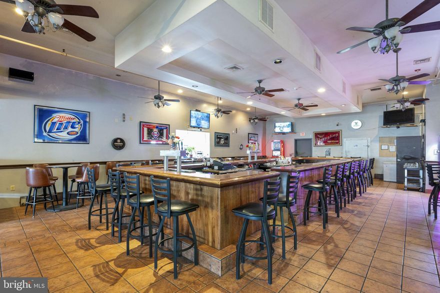 Welcome to Joe's Place in Muhlenberg! Located at 5 Spring Valley Rd this long serving restaurant bar is opening its doors to a new owner! Currently in operation, Joe's Place features a large open concept layout with a  centralized bar creating the perfect atmosphere for a local sports bar and dine-in restaurant! The restaurant offers a private kitchen with an 8 sprinkler commercial-grade hood, three fryers, a gas convection oven, six-burner flat top grill, six-burner stove. All serviced by a commercial dishwasher, three Bain Marie refrigerated topping stations, and a full set of appliances. Additionally, there is a large walk-in refrigerator that houses the beer taps with upto 16 lines available!  The interior is designed to attract and accommodate guests with seating for 36 at the bar, 46 high-top seats, and a 60-seat dining area, complemented by fun entertainment options including, skill machines, pool table, claw machine, and dart board machine. The property also offers three bathrooms, a private office and a private parking for 35 to 40 vehicles. There is a complete building sprinkler system, 2 heating systems and central AC. With its large kitchen space, ample seating, and strong infrastructure, this is an eye-catching opportunity for an operator looking to take over a turnkey establishment with excellent growth potential. Business is currently in operation with an R liquor license with Sunday sales ( also available for sale). Have another business Real Estate need? This is a single detached, 4,000  Sq ft structure, centrally located in Berks county with plenty of parking that can serve many businesses alike! Set up a tour today.