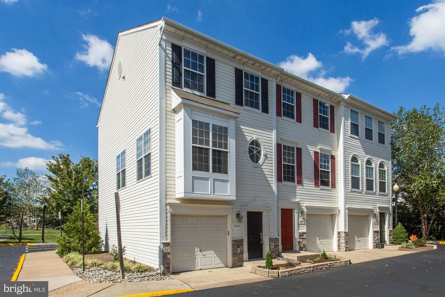 REDUCED! Rarely available garage end unit townhome- 1/2 mile to proposed metro stop*conv. to Greenway, LCP & Waxpool Road.  Huge master suite, sun filled main level with Brazilian hardwood floors and tons of natural light throughout.  Rear deck and patio off walkout lower level w/ full bath/den.  Stainless steel appliances, upgrades throughout.  Will not last!