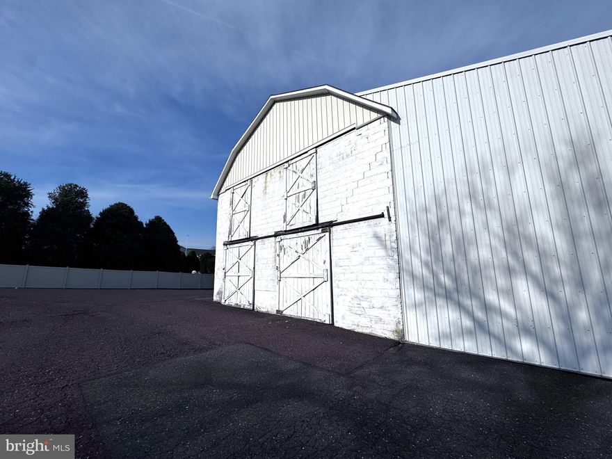 This is the bottom bay on the left side corner available at 437 sq ft. This is being offered for storage only. There is a step down inside the doors. The unit measures 11.5 feet wide and 38 feet deep. The ceiling height is about 12 feet.  The unit can be completely empty with shelves removed or not when rented.  The multi tenant property offers secure access through gate entry and you have the ability to lock your specific unit as well. There are multiple other options for parking and covered storage at this property too. Convenient location to routes 309 and 313. Annual lease being offered but may consider a month to month as well.