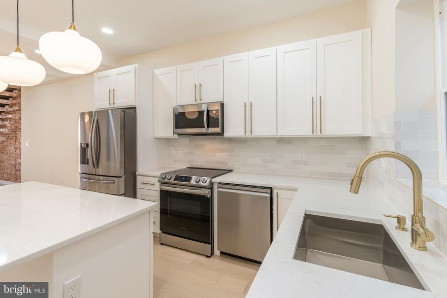 Welcome to 1552 N. 28th Street – where modern luxury meets elevated design in the heart of Brewerytown.

This fully renovated showstopper offers true high-end living with top-of-the-line finishes and sophisticated design elements throughout. The preserved brick façade and striking 8-foot entry door make a bold first impression, setting the tone for what awaits inside.

Step into a light-filled open layout anchored by engineered white-oak flooring and a stunning industrial-style floating staircase with handcrafted steel details. Exposed brick adds warmth and character, flowing seamlessly from the entryway to the upper level. The kitchen is a true centerpiece, outfitted with sleek cabinetry, statement gold hardware, quartz countertops, and premium appliances – the perfect blend of style and functionality. Ideal for entertaining, the kitchen opens directly to a private backyard – your own urban oasis perfect for summer grilling and relaxing with friends.

Upstairs, you'll find three spacious bedrooms, including a luxurious owner’s suite featuring soaring 9-foot ceilings and spa-inspired finishes. The fully finished basement offers even more versatility with a full bathroom and a bonus space that works beautifully as a home gym, office, or guest suite.

Located in one of Philadelphia’s most vibrant and rapidly growing neighborhoods, this home is just steps away from top restaurants, local shops, parks, and public transit.


Experience true luxury living in Brewerytown – this is not one to miss.