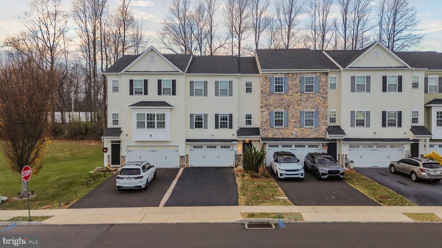 Welcome to 102 Carters Mill Road, a spacious and beautifully upgraded 3 bedroom 3.5 bath home offering an open, modern layout and thoughtful enhancements throughout. The main level features a bright and inviting living area with recessed lighting, crown molding, wide plank LVT flooring, and large windows that fill the space with natural light. The kitchen is equipped with 42” cherry cabinets, granite countertops, and stainless steel appliances, providing both style and functionality. Just off the main living space, the original 2 car garage has been thoughtfully converted into a large workshop and additional living area, ideal for hobbies, storage, home projects, or flexible use. This level also includes a convenient full bathroom, adding comfort for guests or multigenerational needs. Enjoy outdoor living on the low maintenance Trex deck overlooking the backyard, offering a perfect space for relaxing or entertaining. On the upper level, the primary suite features a walk in tub, double sinks, and a linen closet. Two additional bedrooms and the second floor washer and dryer complete this level. Additional highlights include a gas fireplace, wired smoke detectors, a full sprinkler system, and well appointed finishes throughout. Move in ready, exceptionally maintained, and offering rare flexible space, this home is a must see!