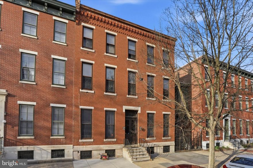 Welcome to this charming tri-level residence nestled in the heart of Historic Spring Garden, perfectly positioned on picturesque, tree-lined Green Street. Set within an elegant, stately brick building of just six residences, this home offers a rare blend of privacy, character, and timeless architectural detail—complete with a serene shared courtyard.

Enter on the second floor into a sun-drenched living space that immediately impresses with soaring 10+ foot ceilings, rich hardwood flooring, and refined finishes throughout. The living and dining areas are accented by triple crown molding, oversized baseboards, deep-set windows with classic wainscoting, and a stunning decorative fireplace with a marble mantle—creating a warm yet sophisticated atmosphere.

The thoughtfully updated kitchen combines style and functionality, now featuring new stainless steel appliances, sleek cabinetry, a farmhouse sink with gooseneck faucet, and tasteful tile flooring and backsplash.

Upstairs, the second level offers a spacious bedroom retreat with hardwood floors and two closets plus an for exceptional storage. Two oversized windows provide peaceful views of the courtyard. Just outside the full bath, custom built-in shelving adds both charm and convenience. The bathroom itself features a penny tile floor, pedestal sink, and a tiled tub/shower combination.

The top level is a true standout—flooded with natural light from a full wall of windows showcasing beautiful city views. This versatile space is perfect as a home office, den, or guest suite.

Additional highlights include dedicated basement storage and an unbeatable location. Enjoy easy access to Whole Foods, neighborhood favorites, acclaimed dining, and cultural landmarks including the Rodin Museum, Barnes Foundation, Philadelphia Museum of Art, and the scenic Schuylkill River Trail.  The entire home was just repainted and ready to move into!  

A rare opportunity to own a character-filled home in one of Philadelphia’s most desirable neighborhoods—this one truly checks all the boxes.