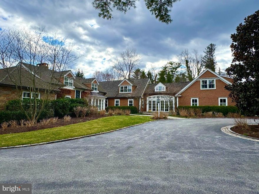 This property is absolutely stunning! With its perfect blend of luxurious amenities and thoughtful design, it is an entertainer's dream, while offering plenty of privacy and comfort. Sitting on a bucolic 2 acres this southern exposure home has lots of privacy and plenty of living space. The chef's kitchen is designed to impress with high end appliances, custom cabinets and views of 2 different patios. The seamless indoor-outdoor flow created by the NanaWall doors are incredible, providing the perfect spaces for relaxation or social gatherings. The family room with floor to ceiling windows is awash in beauty and light. The seamless transition between indoor and outdoor spaces is a unique touch that really highlights the property’s versatility. The layout is perfect for both everyday living and hosting guests, especially with the wine cellar, wet bar, and various patios. And with the gym and pool area, there's no shortage of ways to stay active or unwind. There are two home offices, primary bedroom (on the main floor) with two large walk in closets and two baths. There is a bonus of a 1 bedroom Au Pair suite with washer and dryer over the garage  It’s also near downtown to Wayne and steps to the Radnor walking trail—which is a  perfect mix of quiet luxury and easy access to city life.