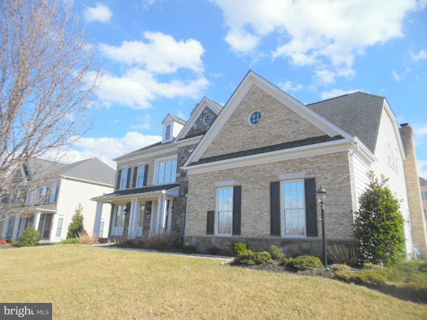 Gorgeous like new Colonial in Montjoy.  Gleaming hardwood floors throughout.  Large gourmet kitchen with island, cook top, double wall oven, and desk area.  Vaulted ceilings in family room with stone fireplace.  Deck off the back.  Finished basement with bedroom, full bath, and game room with bar.  3 Car side load garage.