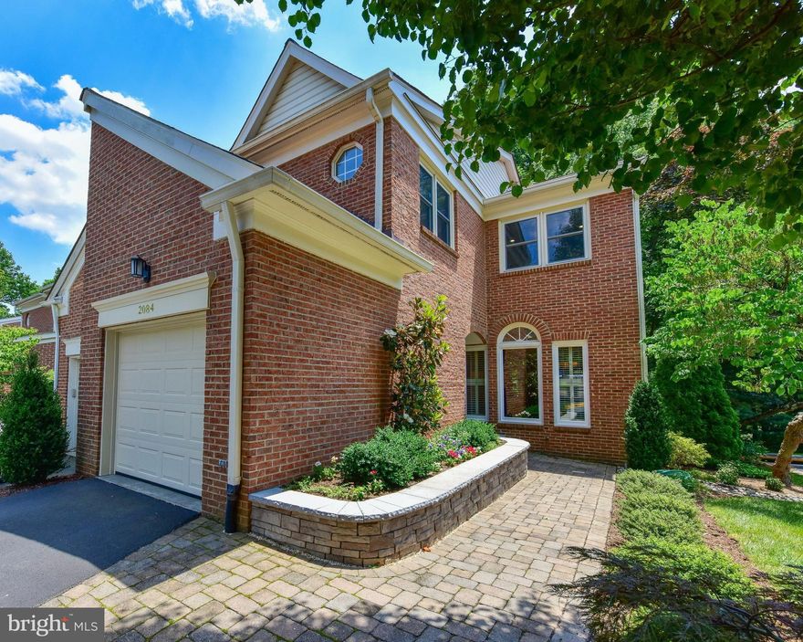 Remarkable Opportunity for luxury townhouse with main level garage.  Fabulous flowing main level floor plan with Palladian windows in large living room and expansive deck off gourmet kitchen. Sumptuous Owner's Suite is large and luxurious with spa bath featuring separate tub/stall shower/water closet.  Two other bedrooms up and one large bedroom with full bath on LL.House backs to parkland.  WOW