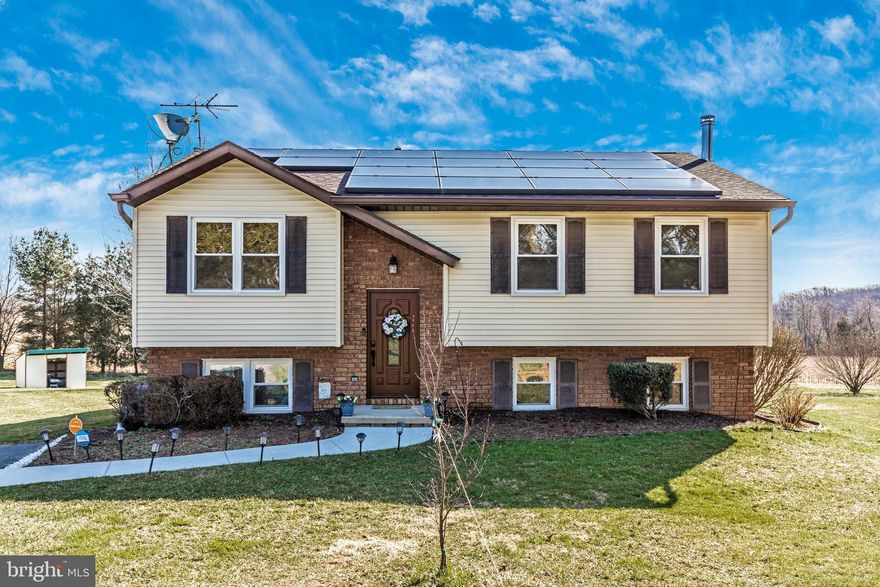 Spring is here! Enjoy the new deck for relaxing in the sun, and the new screens in the screened-in porch when you want some shade. A lovely .97 acre yard to play, garden, exercise, and entertain. When it is time to come inside, you'll enjoy the two fully finished levels with formal and informal spaces and beautifully updated kitchen with Quartz counters. You'll be saving money on your utilities with the Vivint Solar Panels, and Woodburning stove. Home also includes hardwired 15000w gas generator and recently installed 6 inch gutters and downspouts. Proud ownership is shown through out this well maintained and regularly updated home. This property is located in a private setting, NO HOA development, close to route 27 and major routes for a convenient commute.