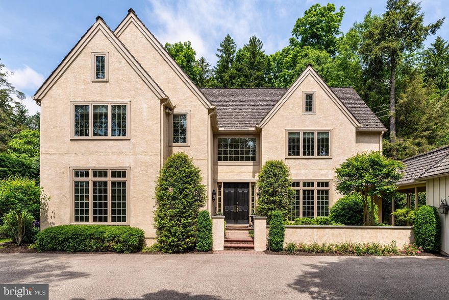 Driving through the tree-lined streets of the private enclave of Denbigh, you truly appreciate this luxurious, quiet neighborhood, surrounded by acres of open space. The curb appeal alone of 1208 Denbigh is truly special. Follow the pavestone pathway, surrounded by lush landscaping, to the charming courtyard entrance. Through the double doors, you will enter the dramatic two story, center-hall foyer. Notice how spacious and airy the home feels. The open floor plan, with gleaming hardwood flooring, is ideal for entertaining, whether hosting a party or small family gathering. The formal dining room to your right easily accommodates seating for twelve. A private office/library to your left is ideal for working from home, with wall-to-wall windows and a built-in bookcase. A powder room and double hall coat closet are also located in the foyer. Step into the elegant sun-filled living room with a gas fireplace. With floor to ceiling windows and French doors that lead to the terrace, you will feel as though you are in a garden solarium. What a perfect spot to enjoy all four seasons of the year! A comfortable family room with a cathedral ceiling, gas fireplace, sky lights, and sliding doors is right off the living room and foyer. The fabulous, bright eat-in kitchen is where the party will always gather. The classic look of this kitchen is timeless with its abundant white cabinetry, soapstone countertops and subway tile backsplash. The large center island provides additional seating and plenty of workspace for the chef, who will appreciate the Sub-Zero refrigerator, Thermador gas cooktop and double Electrolux ovens. A French door opens to the stunning pavestone patio/terrace, where you will feel as though you are dining at a resort. Enjoy the privacy and beauty of this backyard oasis on a summer evening. Not to be missed is the historic root cellar on the property! Upstairs is the resplendent primary suite with two walk-in closets with built-ins. A spa-like ensuite bathroom features a double-sink vanity, soaking tub and glass-enclosed shower. Two other generously sized bedrooms with ensuite bathrooms complete this floor. The finished basement is a cozy spot to watch tv. There is ample space for workout/gym equipment, a play area for children and storage. All utilities for the home are in the basement. This meticulously maintained, move-in ready home boasts a prime location. It is close to major commuting routes, train stations, shopping, restaurants, medical facilities and the many universities in the area. Do not miss the opportunity to own this exceptional home.