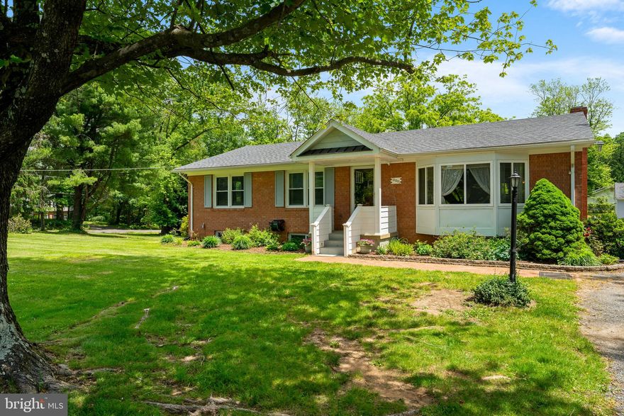 A must see large brick rambler, offering almost 2800 square feet of living space. Much larger than it appears. Well built and well kept all brick two level rambler. Lot is 1.54 acres and a great location for commuters. Close to I-66, commuter rail & Airports. Enjoy the peace & quiet of surrounding area.  Main level has hard wood floors. Bay window in Livingroom. Kitchen appliances replaced in 2021 with stainless steel, new granite just installed and hardwood floors. Kitchen pantry. Front door opens to foyer. Deck off kitchen with large metal awning covering most of deck. Deck overlooking large rear yard. Master bedroom with walk-in closet. Master bath with ceramic tile, double sink and soaking tub. Windows replaced. Roof replaced in 2022 . Mini split unit in basement. Gas log fireplace in basement family room,  water softener. Mini split for basement Rec room. Concrete patio off rec room. Level walkout. Roof fan. Over sized 30X28 detached garage with 220amp electric and 14 tall which could accommodate  a vehicle lift. Check out the gold fish pond near the patio. Basement fish tank and fish can convey if buyer wants it. Woodstove in garage conveys and garage also has water and high speed internet.