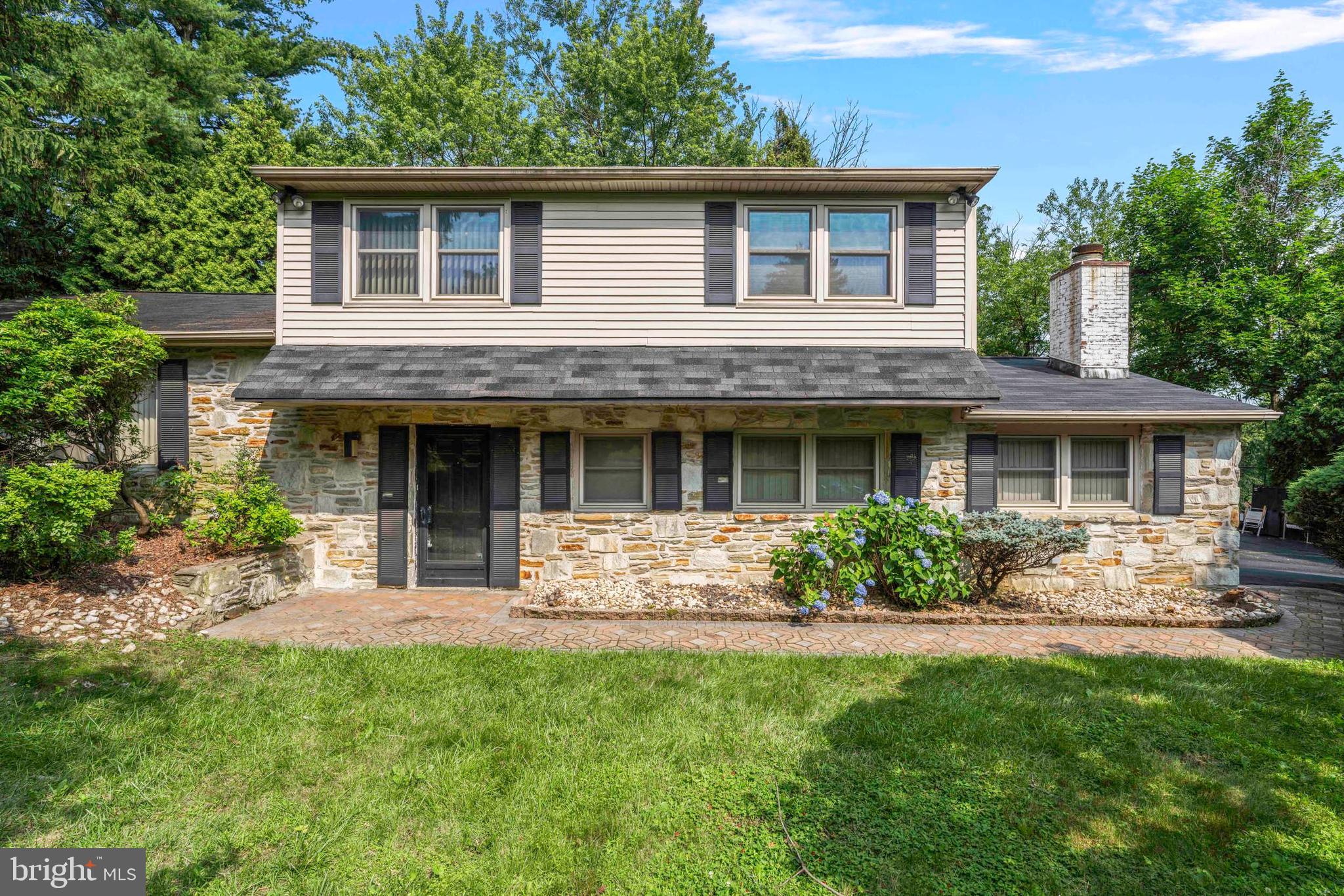 Don't miss this price improvement! Excellent opportunity to own a spacious split level home in Lower Moreland school district. Nestled on a quiet street in the desirable Justa Farm neighborhood this great property sits on almost 2/3 of an acre and offers beautiful sunset views from a two-tiered ample paver patio. The main entry level of this property offers you an office that can be used as a 5th bedroom, a powder room, laundry room with backyard exit and a light filled family room with an impressive stone wood working fireplace. In addition, this floor gives you access to a 2 car garage and a massive multi purpose bonus room with a wood working fireplace and separate exterior entrance. Down a few steps, you will find a newly finished basement waiting for your personal touch! On the top floors you will find spacious living room, dining room and eat in kitchen in addition to 4 good size bedrooms and 2 baths on the top floors. This home is being sold in as-is condition, reflected in the listing price, presenting an incredible opportunity to add your personal touch!