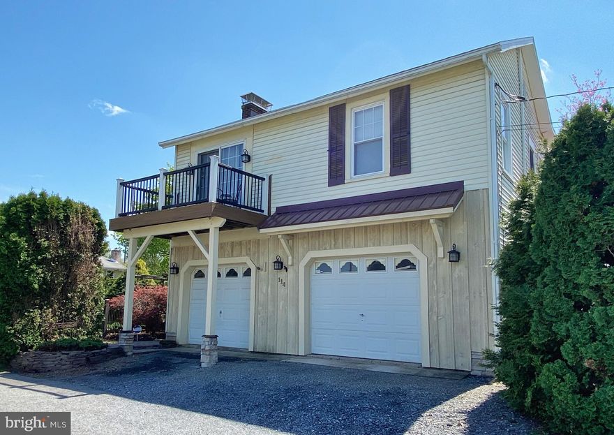 The perfect downsize property for the discerning buyer who seeks a simple, more manageable lifestyle. This is a 2 bedroom, 1 bath home, easily accessed from the street front two car garage or secluded side door entry. The first level features a welcome room office/den and abundance of storage in both garage and back storeroom (with convenient shelving and yard access) Upstairs is cozy with European flair. The Tuscan styled kitchen is eat in, large and well-appointed, and opens to the living room, made bright from glass-sliders to a Trex balcony deck.   The master bedroom is 15 x 11, 2nd bedroom 11 x 10, and full bath is 8 x 5. Central air & ceiling fans keep temps light and airy. Natural finishes throughout: ceramic tile & hardwood floors. Lovely lighting & plumbing fixtures. Sweet and magical best describes the outside exterior. The home is tucked like a gem into a tall and sprawling arborvitae hedge, secured by decorative fencing all around. Here, the lot is completely private, and offers optimal outdoor enjoyment from the pergola covered deck and lush green lawn flanked by walkways, garden trellis, ornamental trees, blooms & shrubs. Includes new roof, updated systems and low taxes. Located on a quiet street in the quaint town of Alburtis, within walking distance of the Alburtis community center, pool, elementary school and fine eateries nearby.