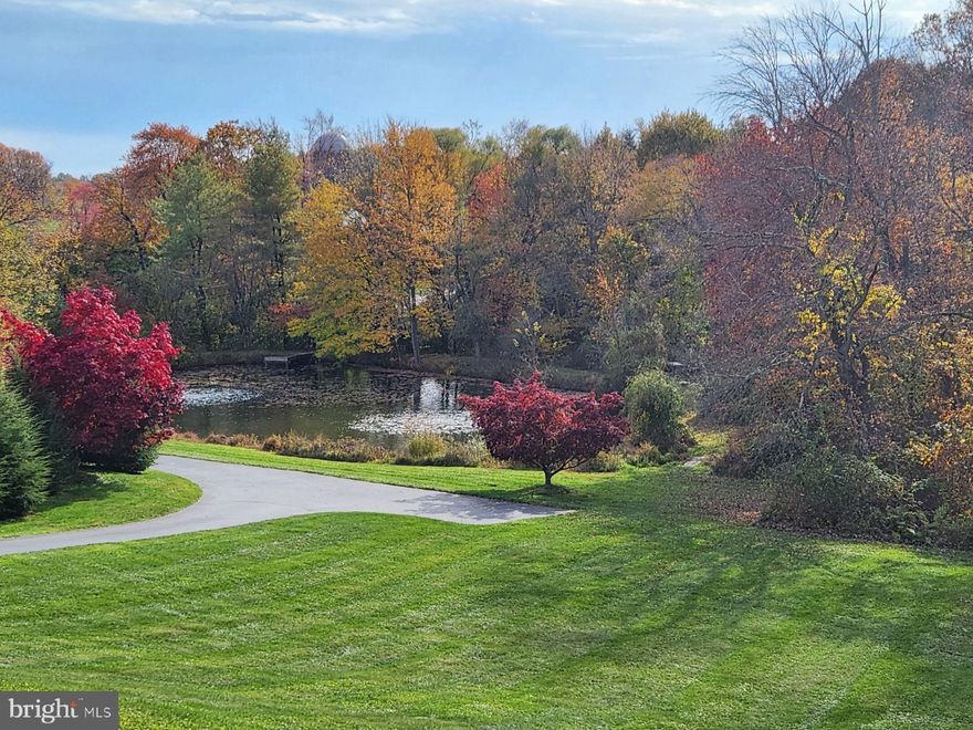 Welcome to 1211 Birchrun Rd, located in beautiful Chester Springs, Pennsylvania! This stunning property offers an exceptional living experience in a serene and picturesque setting.
Situated on a spacious lot, with a beautiful pond,  this well-maintained residence boasts timeless charm and modern conveniences. The exterior showcases a classic architectural design with a combination of stone and James Hardie fiber cement board siding, creating an inviting and elegant curb appeal.

Step inside the front door and be greeted by a grand foyer, featuring hardwood floors and abundant natural light. The main level offers a seamless flow between the living spaces, perfect for both entertaining and everyday living. The formal living room features a cozy fireplace, providing a warm ambiance during colder months.

The gourmet kitchen is a chef's dream, equipped with top-of-the-line stainless steel appliances, granite countertops, and ample cabinet space. Adjacent to the kitchen is a spacious breakfast area with large windows, offering breathtaking views of the surrounding nature.
The second level is dedicated to relaxation and privacy. The expansive master suite is complete with a luxurious en-suite bathroom featuring frameless shower doors and a spacious vanity. Four additional generously sized bedrooms and two full bathrooms provide ample space for family members or guests. There is also a beautiful deck off of the guest room that makes you feel like you are on vacation.

Outdoor enthusiasts will delight in the expansive backyard, perfect for hosting summer gatherings or enjoying peaceful moments of tranquility. The various deck areas offer a great spot for outdoor dining or simply lounging and enjoying the serene surroundings.   Private trails and surrounding woodlands offer endless outdoor possibilities.

Additional features of this remarkable property include a main-level laundry room, a three-car garage, a detached garage with an additional room that can be used as a home office or bedroom.  Also, there is a fully finished basement equipped with a home gym and a half bathroom.

1211 Birchrun Rd is ideally located, offering a perfect balance between privacy and convenience. Enjoy the tranquility of country living while being just a short drive away from shopping, dining, and entertainment options. The property is also within close proximity to major transportation routes, providing easy access to the greater Pennsylvania area.
Don't miss the opportunity to own this exceptional property in Chester Springs. Schedule your private showing today and experience the charm and beauty of 1211 Birchrun Rd firsthand.