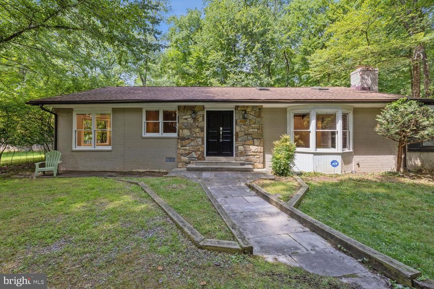 **********PRICE REDUCED TO 3,950************

Welcome to 11611 Danville Drive in Luxmanor. Nestled in a serene park like setting on close to an acre lot, this home features a single-level open floor plan, new kitchen, new bathrooms, expansive living area, and Porcelanosa floors.  This 3-bedroom, 2-bathroom rental home offers an unparalleled living experience. The chef's kitchen is a culinary delight, featuring new stainless steel appliances, a 6-burner gas range, farmhouse sink, and a striking waterfall island with bar stools, all with serene backyard views. The entrance sets the tone with a stone foyer and double entry doors, leading to a spacious step-down living area complete with vaulted ceilings, skylights, cozy carpeting, built-in bookcases, and a wood-burning fireplace. This inviting space opens to a sunroom flooded with natural light, featuring another wood-burning fireplace and access to both the primary bedroom and the expansive yard. The dining area, boasting elegant restored wood floors, is ideally situated off the kitchen and living area, perfect for entertaining. The primary bedroom is a luxurious retreat with large windows, recessed lighting, hardwood floors, and an en-suite bath featuring a Porcelanosa rainfall shower. The second and third bedrooms have large windows for ample sunlight, hard floors, and a Jack and Jill bathroom. Outside, the backyard offers ample space for outdoor activities, including a playground set. Landlord has offered to remove carpet and refinish the hardwood floors and can also provide self standing closets.  The home is served by outstanding schools, all newly rebuilt, and a short few minutes walk from the home. Walk to Pike & Rose for dining and shopping. Enjoy proximity to Cabin John Park, Cabin John Ice Rink, Shriver Aquatic Center, Woodmont Country Club, Metro as well as easy access to major transportation routes, making this the perfect home for both relaxation and convenience.