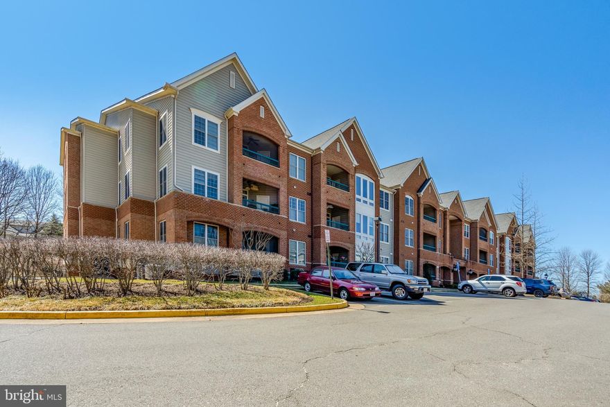 Professional Photos coming soon! Fall in love with the beautiful active adult community of Heritage Hunt.  This unit is conveniently located on the main level allowing super easy access to your new home.  Gorgeous wood floors in the main living area are complimented by a kitchen designed for ease of cooking and a pass-through to the sizable dining area.  The living room offers a mantled fireplace and overlooks a private porch with automatic screens for your outdoor enjoyment.  Finishing off the unit you'll find a great space for an office, 2 comfortably sized bedrooms and 2 full baths!  There are planation shutters on all windows and doors, 4 ceiling fans and crown molding.  You'll love the convenience of a reserved garage parking space that offers access directly into the building elevator.  You will also have a conditioned private storage room on the garage level.  Condo living allows you more time to enjoy the country club lifestyle!  This gated community offers over 750 beautifully landscaped acres, 2-wellappointed clubhouses, a quality restaurant and bar, indoor and outdoor pools, tennis, pickleball and bocce courts, miles of walking paths and over 100 clubs and social events to enjoy.  Golf course memberships are available.  The main clubhouse and restaurant are within easy walking distance from this home.  This community offers easy access to many major commuting routes, shopping, restaurants and entertainment.  It is close to the newer UVA Haymarket Health Center which includes a hospital and many medical professionals' offices.  I can't list everything here, so stop in and visit soon!