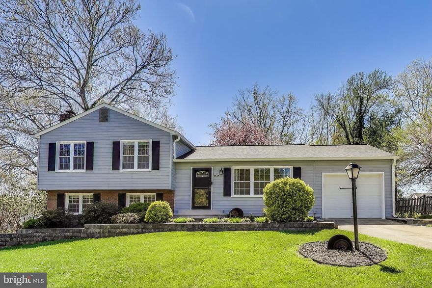 ASSUMABLE LOAN WITH 2.75% Rate! Welcome home to desirable Lake Braddock!  This conveniently located split-level home is bright and airy, with an open floorplan and stylish modern updates on all three levels. Inside the entrance, you’ll discover the living room with built-in bookshelves flanking the cozy fireplace and a large picture window flooding the home with natural light. Gleaming hardwood floors flow seamlessly throughout the open concept layout, making the home ideal for entertaining friends and family. The sleek kitchen has been gorgeously renovated with marble countertops, a classic subway tile backsplash, and stainless steel appliances. The oversized island offers additional cabinet storage and opens the room directly into the spacious dining area. Up a few steps, the tranquil primary bedroom suite boasts abundant closet space and a stunningly updated en suite bathroom. Two additional bedrooms both include wide closets and shared access to the second full bathroom in the hallway. On the lower level of the home, the amply-sized family room offers you a comfortable space with endless options and a gorgeous stone-surround fireplace.  The fourth bedroom on this level provides you with greater versatility for a quiet home office or light-filled playroom. Step outside onto your expansive deck to sip your morning coffee or host a bbq with friends. Enjoy the privacy of your lush backyard as you play, garden or sit under the shade of gorgeous, mature trees. On the front of the home, the attached garage and wide driveway give you convenient parking and storage space. Major home updates include a new roof and gutters (2019), HVAC and condenser (2017), and new electrical panel (2017). Amenities are plentiful, including an outdoor pool, lake access, tennis and basketball courts, playground, community center, and lush green spaces. Not only is this popular community in the highly-sought after Lake Braddock school tier, but Lake Braddock Secondary School is located within the neighborhood. Just minutes to Safeway, Giant, Kings Park Shopping Center, Springfield Town Center, Lake Accotink Park, Kings Park Park, and Audrey Moore Rec Center. Quick access to Burke Lake Road, Braddock Road, Fairfax County Parkway, I-395 and I-495. Schedule a private tour of your new home today and enjoy every moment of the Summer in your new Lake Braddock home! ***Payoff of loan amount is $460,000.***