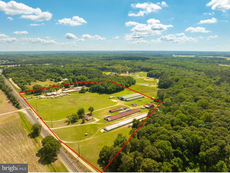 5 acres of Heavy Industrial land for lease for $2,500 per month. Convenient location on Goddard Parkway, gravel drive off Naylor Mill Road. Add'l land available up to 13 acres . Owner will consider fencing and/or stabilizing. Office space also available for lease - 3 office suites available separately or combined, 180 square feet, 270 square feet and 288 square feet. Shared kitchen and restroom.