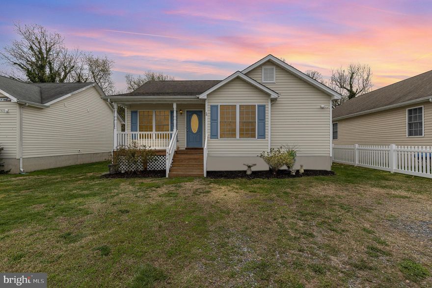 This charming, freshly painted, one- level living home on a conditioned crawl space, located in the desirable Town of Colonial Beach is perfect for first time homebuyers or those looking to downsize. With 3 bedrooms, 2 bathrooms, this home offers comfort and convenience. A welcoming front porch invites you to relax with a cup of coffee  in the quiet mornings or unwind in the evenings. The open floor plan features a cathedral ceiling in the living room, bright windows, and durable laminate flooring  in the living room and hallway. Upgraded LVP flooring enhances the kitchen and bathrooms while carpet and ceiling fans add comfort to all bedrooms. The kitchen is equipped with sleek black appliances and beautiful cabinetry perfect for cooking and entertaining. The spacious primary bedroom boasts a large walk- in closet for ample storage. The back yard is your private oasis, featuring a vinyl fence, composite deck, a firepit, and a 10 X 14 shed for extra storage.  French drains were also installed in the backyard. The owner also just expanded the blue chip stones driveway to fit 4 parking spaces. Colonial Beach offers a laid-back beach lifestyle with easy access to local restaurants and shops-just hop on your golf cart and enjoy the ride. Only a 20 minutes drive to Dahlgren and only 90 minutes to Washington,  D.C. , this well maintained home offers the best of both comfort and convenience. (Details of recent upgrades are available in the home.)