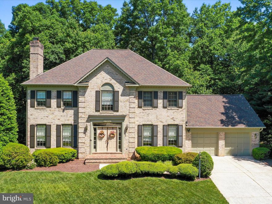 Proudly offered for sale by the original owners, this exquisite detached brick-front home sits on a premium lot in an established neighborhood, boasting a uniquely private setting with only one neighboring home. Spanning over 4,800 square feet of finished living space, this meticulously maintained property features 4 bedrooms and 4.5 bathrooms, making it a great place to call home.  Step inside to a grand two-story foyer, adorned with extensive wood trim and elegant marble flooring, leading into a home filled with refined details. The gourmet kitchen features an island and ample space for culinary exploration. Each of the four wood-burning fireplaces adds a touch of warmth and charm throughout the home, especially in the primary suite which includes a cozy sitting room and a private bath with jetted soaking tub, separate shower and a water closet.  This home benefits from one of only two walkout level basements in the neighborhood, which is 80% finished and includes a vented workshop and a dedicated storage room.   Outside, the property backs to trees, enhancing the sense of privacy and tranquility. The rear deck and patio provide perfect spaces for outdoor relaxation and entertainment. Despite its secluded feel, the home remains conveniently close to shopping, dining, and commuter routes.  This property represents a rare opportunity to acquire a well-appointed home that has been lovingly cared for by non-smokers without pets. Ideal for those who appreciate privacy, space, and luxury in a prime location, it promises a lifestyle of comfort and convenience surrounded by nature.