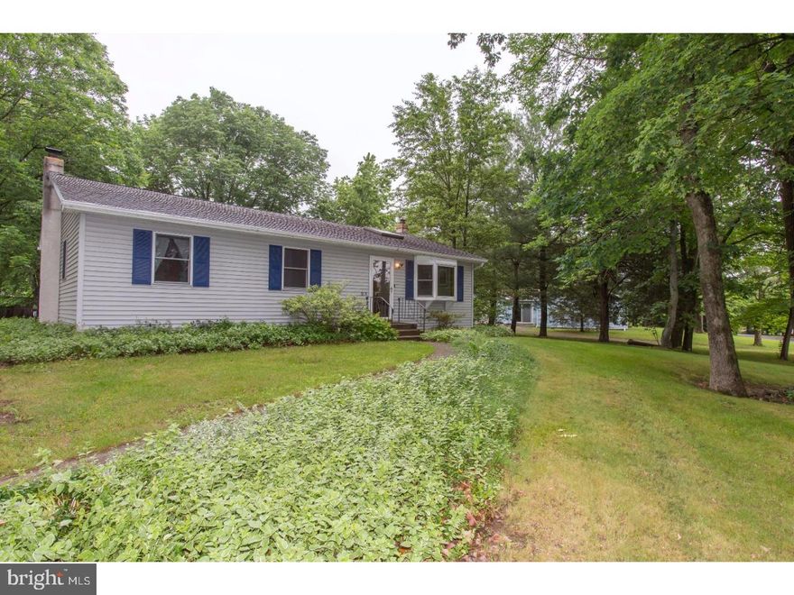 This adorable ranch home has great curb appeal!  It is located on .40 acres .  As you enter in the living room you will find wood floors and a skylight that allows ample amounts of light.  The large bay window allows you to over look your front yard.  The french doors off the dining room lead you to an oversized deck overlooking your flat backyard and detached garage.  Off the kitchen you can walk down the hall where you will find a full bath and three carpeted bedrooms complete with ceiling fans.   The master bedroom has a half bath attached.   The basement is a great extension of your living space!  There is a large bar and sitting area.  The pellet stove creates a great ambiance while being a functional alternative for heating the home. This home is convenient to Spring Mount Ski Area, the Perkiomen Trail, shopping, dining and more!