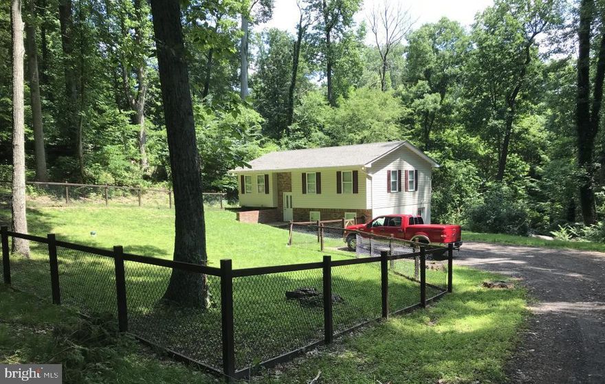 Well maintained home with room for everyone. Hardwood floors on upper level. Stainless steel appliances, Granite countertops, upgraded cabinets make for a beautiful kitchen. 3 bedrooms 1.5 baths up and 1 bedroom and full bath down. Nice size family room. Side basement entrance comes into mud room. Laundry room with sink. Deck. New roof shingles. Plentiful closet space. Fenced front yard