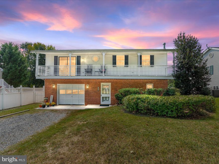 Welcome to 100 Midway Drive — where every day feels like a getaway.

Imagine waking up to the sound of birds, hopping on your golf cart, and cruising down to the beach for a quiet morning by the water. That’s life in West View Shores. This charming 4-bedroom, 2-bath home is designed for easy living and endless weekends. Step inside and feel instantly at home. The first floor offers a flexible layout with a cozy sitting area, a spacious primary bedroom, a full bath, and convenient inside access to the garage. Upstairs, the bright eat-in kitchen opens to the sunny living room, where sliding doors lead to a spacious balcony — the perfect spot for your morning coffee or a quiet evening watching golf carts roll by. The dining room connects seamlessly to a newer back deck, giving you multiple spaces to relax or entertain outdoors. Three additional bedrooms and a full hall bath complete the second level.

The large fenced backyard features a newer storage shed and room to enjoy outdoor activities. The 1-car garage was thoughtfully designed with front and rear access, making it practical for beach days or golf cart parking. West View Shores residents enjoy access to incredible community amenities — including a private beach, boat ramp, dock, and scenic waterfront areas where you can take in breathtaking sunsets over the Chesapeake Bay.

Located just minutes from Middletown, Delaware, the 301 Bypass, Sassafras and Bohemia Rivers, marinas, and waterfront dining, 100 Midway Drive offers the perfect mix of tranquility and convenience.