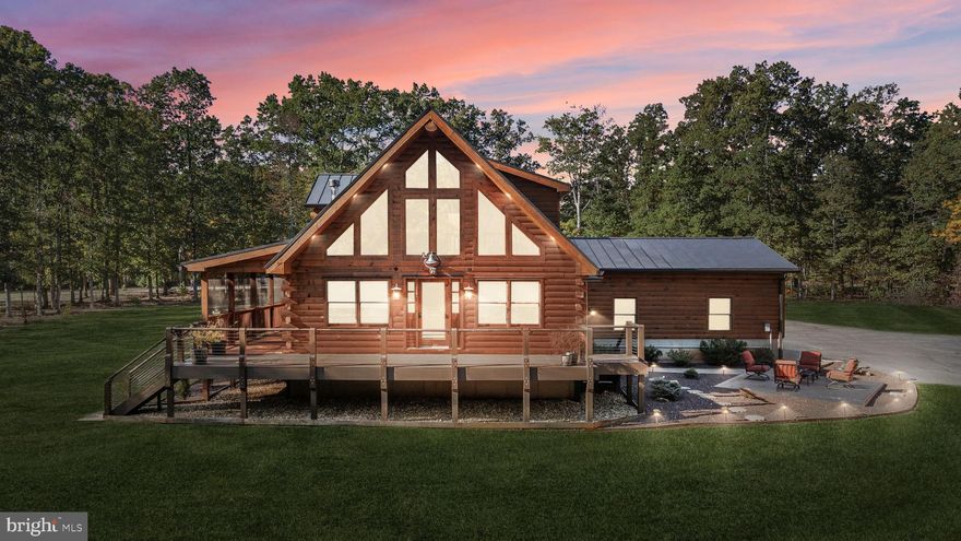 Discover the epitome of luxury living in this breathtaking custom Craftsman home, meticulously updated with an array of bespoke features that redefine modern comfort and elegance. Nestled on eight pristine acres with established walking trails and located within a serene subdivision—free from HOA restrictions—this property offers a unique blend of tranquility and sophistication.

As you step through the vaulted entrance you will notice an antique cast iron bell, the resonating sound will welcome family and guests as they arrive.  Upon entering you will be greeted by soaring beam ceilings, custom wood trim, and stunning shiplap walls that exude warmth and character. The open floor plan seamlessly connects the spacious great room, adorned with a cozy gas fireplace and a charming freestanding wood stove, to the expansive kitchen and dining area. The ambiance is elevated by all-new custom lighting, creating an inviting atmosphere perfect for both entertaining and relaxation.

The heart of the home—a beautifully updated kitchen—features brand new appliances and ample counter space, making it a culinary dream. The first-floor primary suite is a sanctuary of comfort, complete with it's own private bath & large walk-in closet. Upstairs, another primary bedroom with an en-suite bath awaits, complemented by a cozy loft that overlooks the grand great room.

Venture to the lower level, where a separate entrance opens into a versatile space—ideal for guests, an in-law suite, or even a short-term rental. This area includes an additional bedroom, a full bath, an office, and a generous storage area.

Outside, indulge in the custom TimberTech deck with unique railings, perfect for soaking in the serene surroundings. The property boasts an enormous 40’ x 50’ detached workshop, featuring oversized doors, an office area, and a car lift, catering to hobbyists and entrepreneurs alike. A 15’ x 35’ lean-to is perfect for a woodworking shop or additional storage needs. The solar panel system on the garage powers the main house, ensuring sustainability and significant savings on energy costs. 

With a new metal roof, updated HVAC system, and meticulously refinished exterior, this home is not only stunning but also practical. Located just moments from Lake Anna, where you can enjoy sun-soaked days on the water, this property is a rare find.

Don’t miss your chance to own this one-of-a-kind Craftsman retreat, complete with exclusive features that will leave you in awe. Schedule your private tour today and let this stunning home welcome you to a life of luxury and serenity! 

Here is more detailed information on the renovations: HVAC system replaced, new metal roof installed and outside re-stained and sealed in 2022. New Gutters, Tankless Hot Water Heater, and kitchen appliances added in 2023. New carpet just installed in the main floor bedroom October 2025. VA assumable loan!