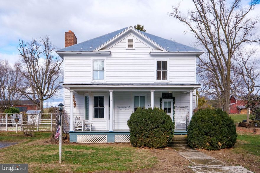 A 1906 white farmhouse with 3 bedrooms and 3 baths in enchanted village of Port Republic. All the charm and character of an old well-built house surrounded by history and close-knit neighborhood. Wormy chestnut wood floors on the main floor, 9-foot ceilings, wood burning fireplace in the great room, spacious kitchen with maple cabinets, and pine floors upstairs.  Some windows have original handblown glass. Several outbuildings on the property including a two-story wash house/workshop and a pool house (old outhouse). Stonewall Jackson's men marched through the alley that is now made a part of this property (half of it) during the Battle of Port Republic. With a little TLC this could be your dream house.
Sold as is where is.