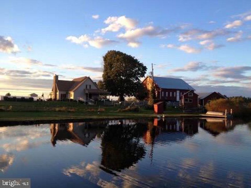 TRANQUIL & PEACEFUL PARADISE waiting for YOU! Come experience this remarkable farm situated on 65+ acres. The main farm and (2)-2 acre lots deeded separately. Stepping into this wonderful  Cape Cod home you will find beautiful hardwood floors through out the first floor and an open floor plan. A kitchen with double oven, an island and stainless steel appliances. The  living room is spacious with a mountain stone gas fireplace. There is a first floor Primary Br with full bath and Lg walk-in closet. The second floor offers 3 spacious bedrooms with walk-in closets. Moving to the partially finished basement and you will find 2 more Br's and an office and an entertaining area. But wait, there's more! Step outside to a wonderful inground pool, a historic bank barn with horse stalls, elec & water, an additional metal pole building, also two additional sheds for poultry, a large pond and a playhouse. Sit back and enjoy the wildlife as they sip water from the spring fed pond or take a walk through the many trails cut into the wooded area of the property. Don't forget about the extra large pavillion made for entertaining. This is a MUST SEE PROPERTY!