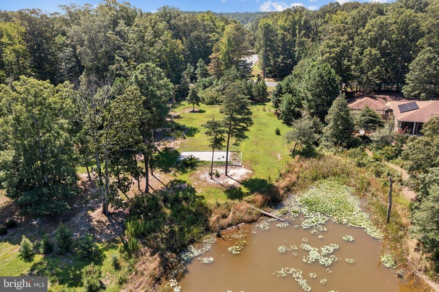 This is an amazing opportunity to build your own home. This lot is level and cleared with waterfrontage on Black Pond in Harbour Point Community. Artesian well is already installed. Culvert is already installed. Build 50 ft. from the water's edge! The community allows docks and electric boats on the pond and offers waterfront nature trails, club house with pool, tennis, beautiful sand beach, boat ramp on Hacks Creek and more!