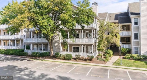 Photo of 14317 Climbing Rose Way #104, CENTREVILLE, VA 20121 (MLS # VAFX2339838)