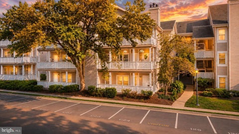 Photo of 14317 Climbing Rose Way #104, CENTREVILLE, VA 20121 (MLS # VAFX2339838)
