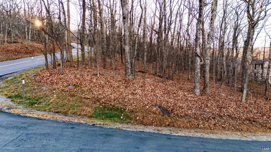 Walk  to skiing from this large corner homesite offering views of Devils Knob mountain. Gently sloping toward the view its an ideal site to build a walk out first floor with the main level high enough to take advantage of the view yet allowing easy access to your home.