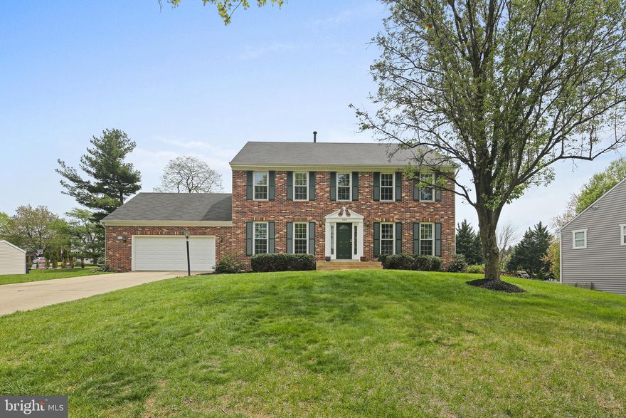 This gorgeous colonial offers the perfect balance of comfort and updates—plus a two-car garage to make rainy or snowy days a breeze. Head inside through the laundry room or follow the walkway to the front door and into a bright, welcoming main level. Stunning hardwood floors (new in 2025!) flow from the dining room to the living room, and French doors open to a cozy family room with a brick-surround fireplace and access to the backyard patio. The remodeled kitchen (2021) ties everything together with stylish black appliances, upgraded counters, a custom tile backsplash, and a sunny breakfast area that connects to the family room. Upstairs, you’ll find five generously sized bedrooms, all with great closet space and fresh carpet (also 2025). The roomy owner’s suite feels like a retreat with a cathedral ceiling, ceiling fan, and a spa-inspired ensuite bath featuring a soaking tub with custom surround, double vanity, and updated tilework. A second full bath in the hall serves the additional bedrooms. The finished lower level is ready for fun—whether it's movie marathons, game nights, or just a little extra space to spread out. There's also a full bath and unfinished storage space for your seasonal gear or hobby supplies, plus a walk-up to the backyard that makes outdoor access easy. With over $120K in thoughtful upgrades, this home is move-in ready and waiting for its next chapter. Welcome home!