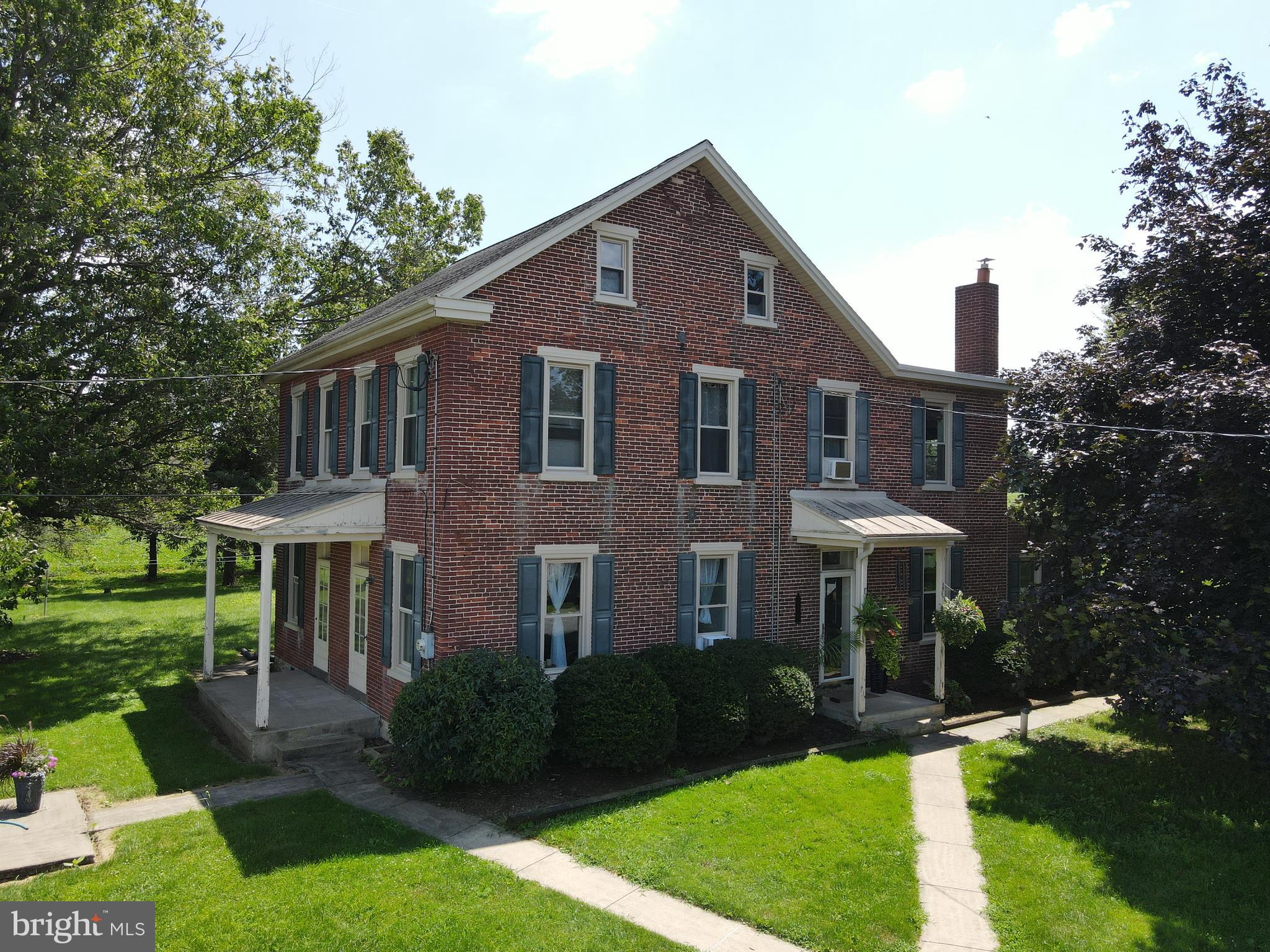 This property will be offered at Public Auction on Monday, October 6, 2025 @1pm. The listing price is the opening bid only and in no way reflects the final sale price. 10% down due at auction, 2% transfer tax to be paid by the purchaser, real estate taxes prorated. Located in a highly desirable area between Lititz, Manheim, and East Petersburg, this picturesque 68.5-acre farm includes approximately 63 acres of productive limestone soil. With excellent road frontage along both Route 72 and Quarry Road, the property offers visibility and accessibility for agricultural use. The property is well-equipped for farming operations, featuring a 200+ head cattle barn with a new roof, a spacious shop with a loading dock, a feed lot with capacity for over 220 cattle, a pole barn, harvestore and concrete silos. Additional amenities include three wells, a 9’x15’ walk-in cooler, and a standby generator hookup—enhancing both functionality and flexibility across the farm. The two-story brick farmhouse offers a cozy living room, kitchen, formal dining room, family room, four bedrooms, 2.5 bathrooms, a laundry room, mudroom, and an unfinished basement. All buildings are perfectly situated at the rear of the property accessed by long driveways from both Route 72 and Quarry Road. Enrolled in Clean & Green but not preserved, this farm presents a rare opportunity to own a productive and versatile property in the heart of Lancaster County.