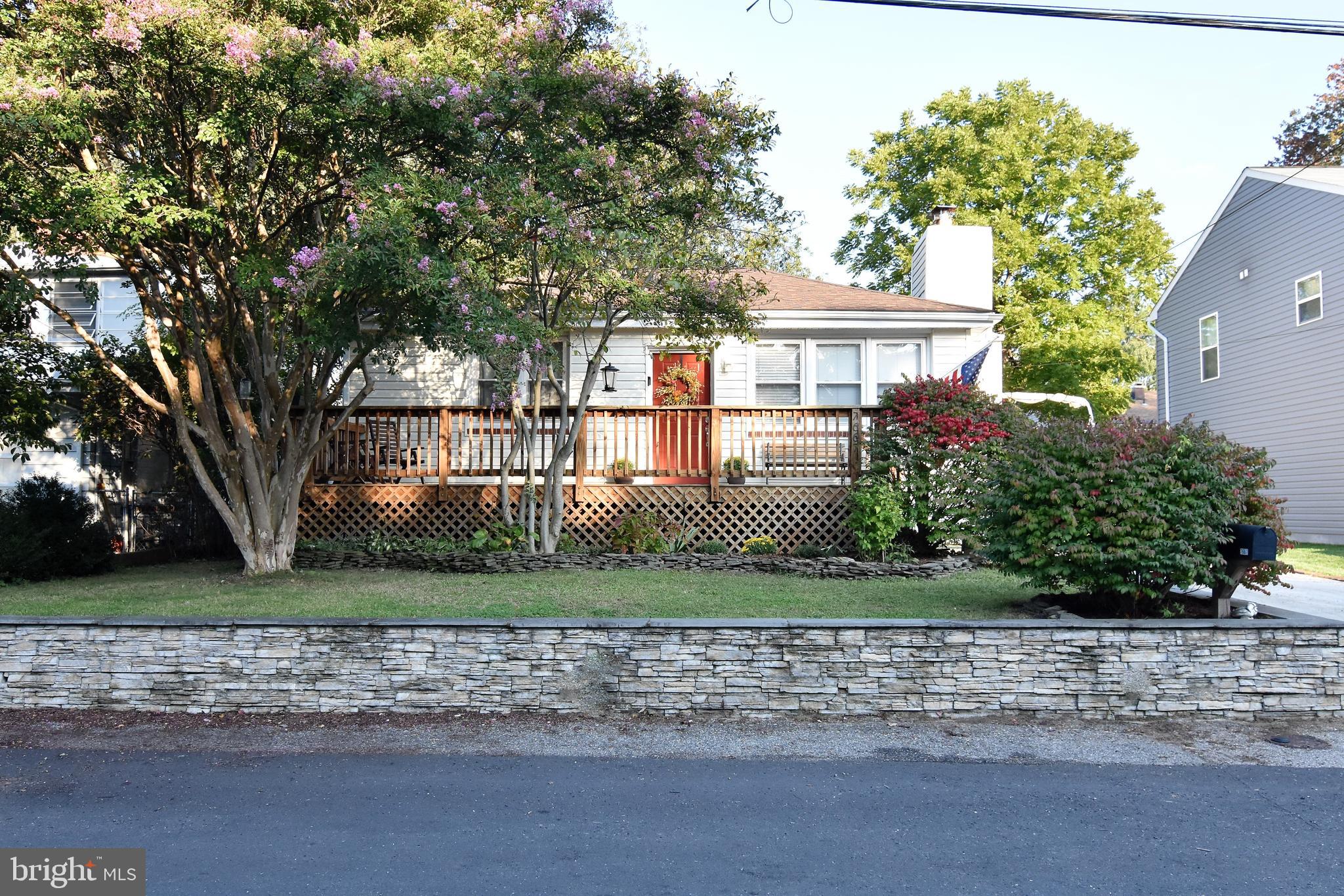 WATER VIEW!! UPDATED RANCHER WITH A LOWER LEVEL, 2 FULL BATHS, SUNROOM OFF OF KITCHEN, WHITE VINYL PRIVACY FENCED REAR YARD WITH DOUBLE GATES. HARDWOOD FLOORS, GRANITE COUNTERTOPS, SS APPLIANCES JUST A FEW STEPS AWAY FROM THE COMMUNITY BEACH AND BOAT RAMP