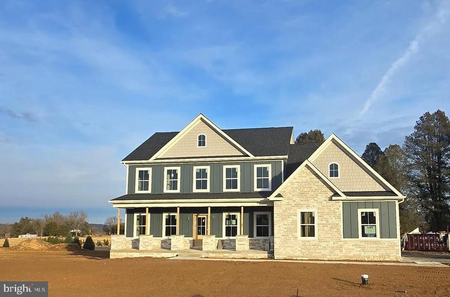 Delivery 2/15/2026! Timeless Colonial Charm Meets Modern Comfort — in the New Community of Hallmark Glen!

Discover a perfect fusion of classic elegance and contemporary luxury in this newly constructed Colonial home, nestled on 2 +/- acres. Offering unmatched privacy and peaceful surroundings, this refined retreat delivers the comfort of modern living without sacrificing timeless charm.

A beautifully paved driveway sets a sophisticated tone, leading to a striking Colonial façade enhanced by a full-width front porch with Craftsman-style columns — a perfect blend of traditional architecture and inviting curb appeal. Whether you're sipping morning coffee or unwinding in the evening, this charming porch offers a warm welcome and a peaceful place to relax.

Step inside to an open-concept floor plan bathed in natural light, where there are expansive windows that frame picturesque woodland views.

At the heart of the home lies a chef-inspired kitchen—complete with quartz countertops, custom cabinetry, stainless steel appliances, and a spacious center island perfect for casual dining or lively gatherings. The adjoining formal dining area and cozy family room with a fireplace create a warm and welcoming ambiance for both entertaining and everyday living.

The main-level primary suite is your personal sanctuary, featuring a spa-like en-suite bath with a soaking tub, walk-in shower, dual vanity, and generous walk-in closet. A versatile bonus room on this level is ideal for a home office, library, or playroom — tailored to your lifestyle needs.

Upstairs, three spacious bedrooms offer comfort and privacy, each with easy access to private or semi-private bathrooms—perfect for family members or guests.

Step outside onto the expansive composite deck to take in the beauty of your wooded oasis. Whether hosting al fresco dinners, or simply enjoying the sounds of nature, this 2-acre property invites endless outdoor enjoyment.

The fully finished garage is designed with convenience in mind, featuring two automatic openers, a pedestrian door, painted walls, finished flooring, and ample storage space.

In addition to its peaceful, secluded setting, this home is ideally located near a wealth of historical and recreational attractions. Explore nearby Civil War battlefields, hike or bike along scenic trails, or take a short drive to the vibrant towns of Harpers Ferry, Charles Town, Leesburg, and Winchester. Whether you're a history enthusiast, outdoor adventurer, or just looking to enjoy charming local destinations, you'll find something for everyone just minutes away.  

Though tucked away in nature, you’re just a short drive from top-rated schools, shopping, and everyday amenities. Whether you're looking for your forever home or a luxurious weekend escape, this Colonial masterpiece offers the best of all worlds—timeless style, modern comfort, and natural beauty.

Some pictures are of a similar home previously built. Price includes 1120 square feet of finished basement including a full bath.