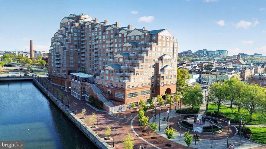 High floor Scarlett Place 2BR/BA condo, offers luxury waterfront living in the heart of downtown Baltimore, ideally situated between Little Italy and Harbor East with scenic harbor views and direct access to several family friendly parks, promenades, dining, shopping, and entertainment, Pier 6 open air concert pavilion, National Aquarium. This bright east-facing 2BR/2BA condo filled with an abundance of natural light, spacious at 1,457 sq ft features an open-plan layout with bedrooms positioned on opposite sides for added privacy, a private balcony, Italian marble entryway, updated seamless LVP flooring kitchen/dining/living area, modern kitchen appliances, adjoining living and dining areas, generous storage and one secure garage parking space.
Residents enjoy exceptional communal amenities including a manned front desk, secure building access, wheelchair accessible, full service elevator access, resident lounge, 24/7 gym and heated indoor pool, harbor-view water side outdoor secure terrace with BBQ and lounge areas, and additional storage, secure garage.

Recent condo updates include a 50 gallon fiber glass hot water heater, a large in-unit stacked washer/dryer, dishwasher and microwave. Seamless LVP flooring throughout kitchen/dining /living areas. Annually inspected and maintained CAC unit.

The condo offers impressive views of Baltimore’s landmarks including the Phoenix Shot Tower, Johns Hopkins Hospital dome, and Patterson Park Pagoda to admire.