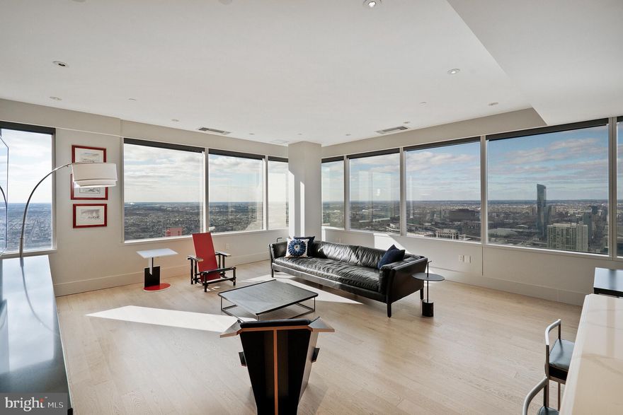 THE VIEW BELONGS TO YOU! - Enjoy breathtaking panoramic city views from this two bedroom plus den, two and a half bath residence in the sky.