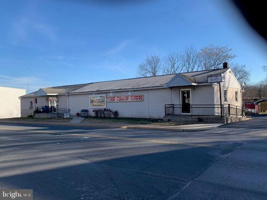 high traffic street ,out side deck , can be 2 or more units, new loading doors ,handicap accessible, basement work bench area with lighting, excellent outdoor lighting, 2 restrooms. Sale price does not include business or inventory(can be negotiated), close to interstates, 2 levels. GREAT OPPERTUNITY to start your own business...Attic storage.