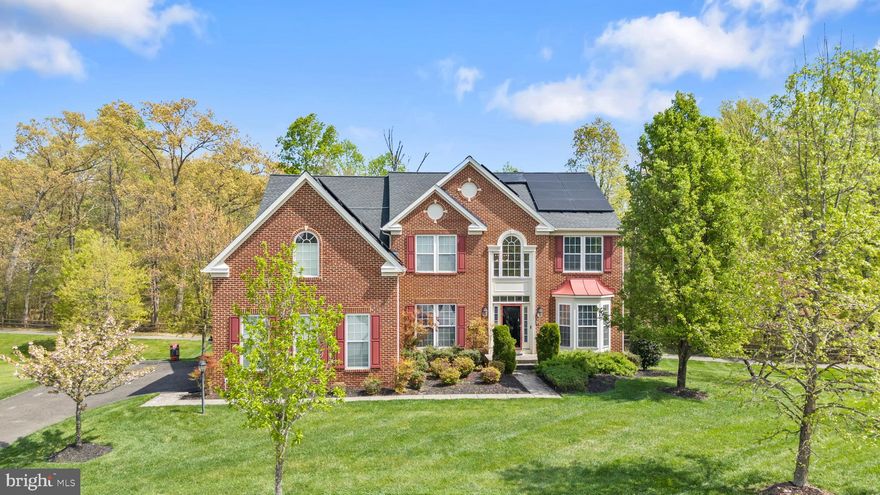 Welcome to this beautifully maintained brick-front Colonial in the sought-after Woodburn Estates subdivision, offering space, comfort, and a layout designed for both everyday living and entertaining. Set on over half an acre and a total of 6118sqft, this home makes a strong first impression with its classic curb appeal, manicured lawn, expansive driveway leading to a side-entry three-car garage, and 6 rooftop solar panel systems (included with purchase). Step inside to a bright and inviting interior featuring hardwood floors, abundant natural light, and a thoughtful flow between formal and casual living spaces. This home is equipped with a water treatment system and an entire home surround sound system, delivering seamless, high-quality audio throughout ideal for both everyday living and entertaining. 


The main level offers a seamless blend of functionality and style, including a mudroom/laundry, formal living room, spacious dining room, and an office/bedroom—perfect for working from home. The open-concept kitchen is the heart of the home, complete with generous cabinetry, spacious walk-in pantry, granite countertops, a center island, and a breakfast area that opens to the family room with a cozy fireplace. Just off the kitchen, a light-filled sunroom with beautiful skylights provides the perfect space to relax, unwind, or enjoy morning coffee with views of the backyard. 


Upstairs, you’ll find a well-appointed layout with four spacious bedrooms and three full bathrooms, including a large primary suite with a sitting area, two walk-in closets, and a private en-suite bath designed for comfort and relaxation. Two of the secondary bedrooms are connected by a convenient Jack and Jill bathroom, offering both privacy and functionality and the fourth bedroom with a private en-suite bathroom. 



The fully finished walk-out basement expands your living space even further, featuring a large recreation area with another fireplace creating a warm and inviting space for entertaining guests, a beautiful built-in 6 chair bar with granite countertops, a fully functional insulated home theater with private surround sound, and a full bathroom. Enjoy outdoor living on the expansive rear deck overlooking a private, tree-lined backyard and a walk out patio with a sitting wall—perfect for gatherings, relaxing evenings, or simply enjoying the peaceful surroundings.  The home also features a yard sprinkler system, making it easy to maintain the beautifully landscaped grounds.  It offers not just space—but a lifestyle of comfort, convenience, and connection.



Located in the Woodburn Estates subdivision, the neighborhood offers a peaceful setting with a running trail for outdoor enjoyment and a playground area for little ones, while still being conveniently close to major commuter routes, shopping, dining, and everyday essentials.