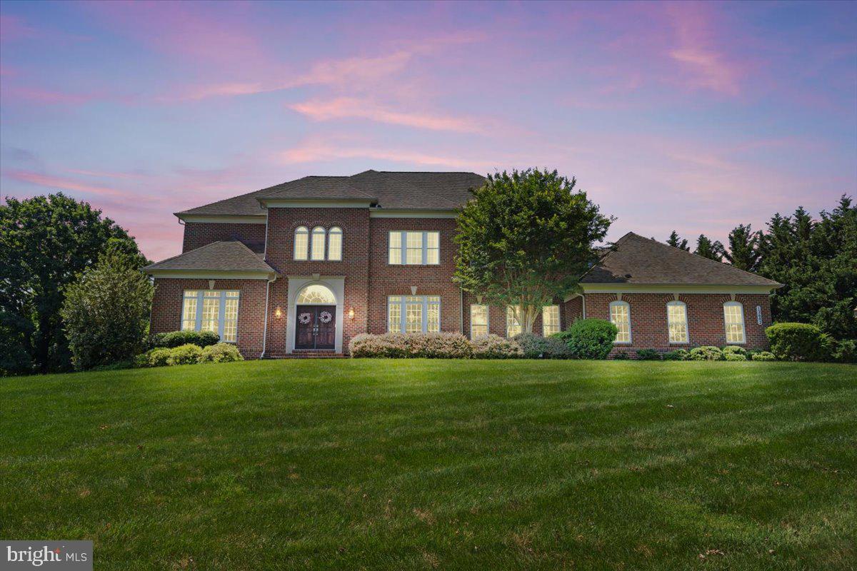 Welcome to this impressive, modern brick estate in the coveted Belmont Farms community, offering nearly 8,000 square feet of luxurious living space on 1.2 beautifully manicured acres. Notably, this property boasts the title of World's Best Kitchen from the 2022 International Property Awards in London (https://www.baltimorestyle.com/a-star-among-kitchens/). The award winning kitchen includes twin islands with striking stone waterfall countertops, a 48" 8 burner Bluestar range, a 36" stainless Bluestar refrigerator with two separate 24" Subzero refrigerators integrated into the cabinetry plus two Bosch dishwashers, also integrated into the cabinetry. Additionally, the beverage center features a Subzero wine fridge and a Subzero mini-fridge. This stunning home also features a three car garage, lush landscaping, and a spacious main level designed for both comfort and entertaining. Enjoy a grand living room, formal dining room and private office/den. The main level also includes two stylish half baths and a sun drenched great room with skylights that opens to an outdoor oasis complete with a pergola, custom grill station, firepit, and expansive yard. The fully finished lower level boasts a second kitchen, state of the art theater room, workout studio, and a fifth bedroom with a full bath and an additional half bath. Upstairs, the luxurious primary suite is a true retreat with a fireplace, dual walk in closets, a dressing area, and an incredible spa like bath with a curved wall, dual vanities, and elegant finishes. Three additional bedrooms each feature their own walk in closets and en suite baths. This exceptional home combines elegance, comfort, and space in one of the area’s most sought after neighborhoods.