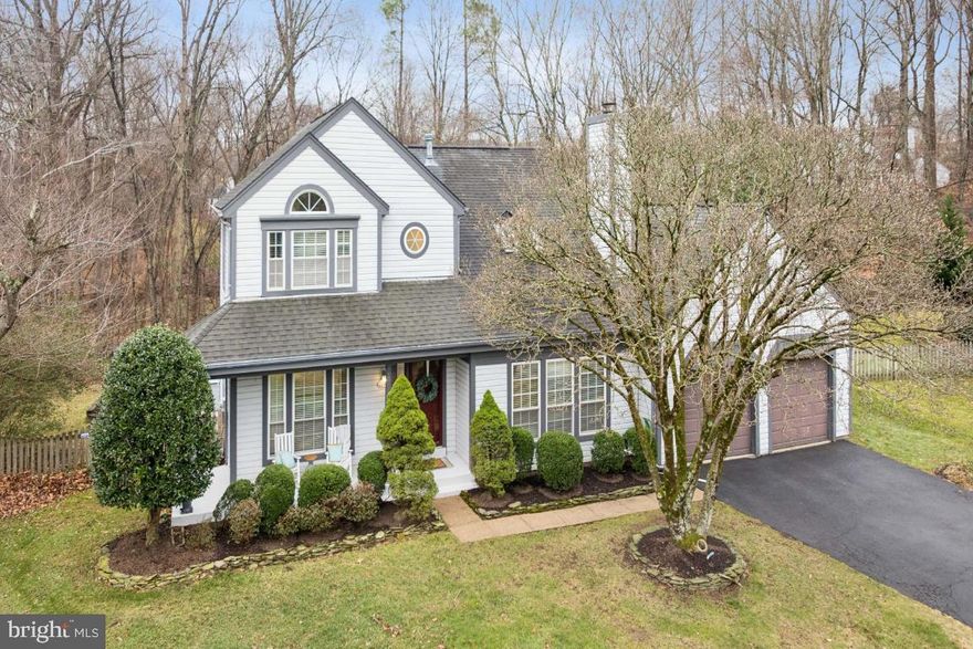 Located in Chantilly, Virginia in sought-after Northern Virginia's Waverly Crossing. This beautifully updated single-family home sits on a quiet cul-de-sac on over a quarter-acre lot backing to wooded parkland with walking trails, offering privacy, serenity, and everyday convenience. Be sure to take the virtual tour!!

A charming L-shaped covered front porch with room for rocking chairs welcomes you into the foyer. Gleaming real hardwood floors span both the main and upper levels. The sun-filled family room is a true centerpiece, featuring floor-to-ceiling picturesque windows, a dramatic two-story vaulted ceiling, skylights, and an open staircase that enhances the home’s open and airy design.

The remodeled kitchen is open to the family room and thoughtfully designed with 24-inch cabinetry, pantry cabinets, granite countertops, upgraded stainless steel appliances, a built-in microwave, built-in wine rack, window plant shelves, and a desk nook or coffee bar. Adjacent to the kitchen is a combination living and dining room with recessed lighting and hardwood floors, perfect for entertaining. A main-level half bath adds everyday convenience.

Just off the kitchen, the enclosed sunroom features windows galore, a cathedral ceiling, and skylights, creating a bright, relaxing retreat year-round. The sunroom opens to a spacious composite deck and slate patio—ideal for outdoor dining, entertaining, and enjoying the peaceful wooded backdrop.

The upper level offers a spacious primary suite with a cathedral ceiling, beadboard wainscoting, hardwood floors, a walk-in closet with pocket door, and a beautifully remodeled primary bath with dual sinks and linen towers. Two additional bedrooms feature hardwood floors and built-in closet details, while the hall bath has been completely and tastefully remodeled.

The finished lower level provides flexible living space with a large recreation room, an office or craft room, and a full bath. With a private door, this area can easily serve as a guest suite or fourth bedroom.

This home is located within a highly sought-after school pyramid, including Rocky Run Middle School and Chantilly High School.

Commuters and frequent travelers will appreciate the location, approximately 20 minutes to Washington Dulles International Airport, with easy access to I-66, Route 50, Fairfax County Parkway, and Route 28. Outdoor enthusiasts will love being just minutes from Ellanor C. Lawrence Park, offering miles of scenic walking and nature trails. Washington, DC is approximately 35 miles away, providing access to fine dining, shopping, theater, and world-class national museums.

A rare opportunity to own a move-in-ready home that combines timeless architecture, modern updates, excellent schools, commuter convenience, and a natural park-like setting, right in the heart of Chantilly.

Replaced HVAC and outside compressor are about 5 years 
Roof replaced about 10 years ago
Hot water heater replaced 8-10 years ago
Wood floors throughout, kitchen, primary bath, and upper level hall bath remodeled!